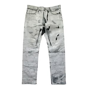 Crackled painted thigh zip denim
